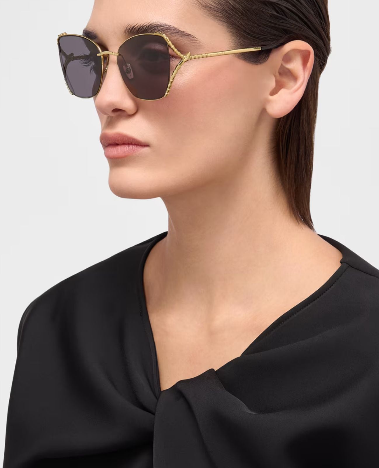 Bvlgari gold butterfly sunglasses worn on model
