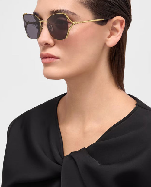 Bvlgari gold butterfly sunglasses worn on model