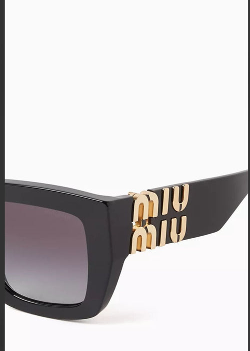 Miu Miu black sunglasses worn on model