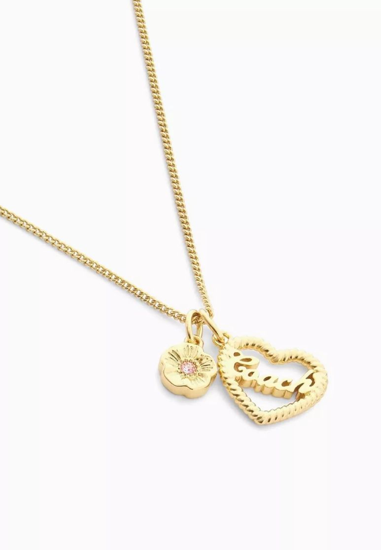 Royal gold heart necklace worn on model