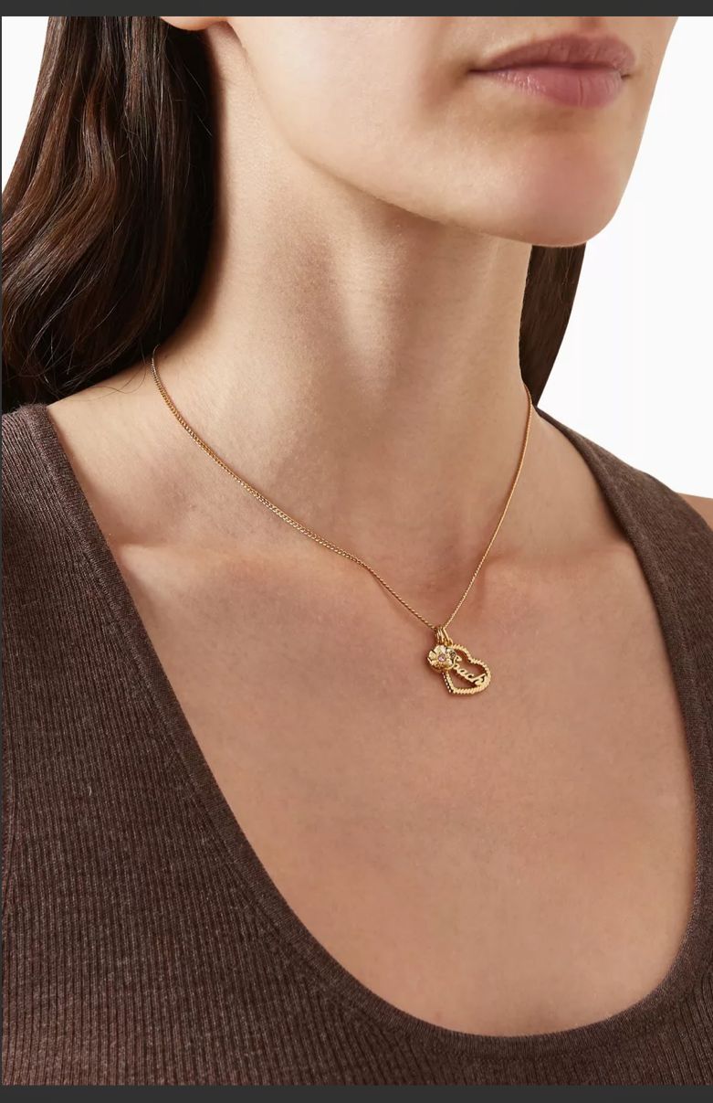 Royal gold heart pendant necklace close up detail